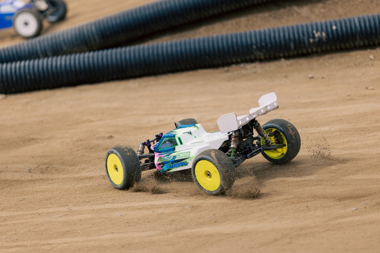 SWORKz S35-T2 truggy roosting through the sweeper